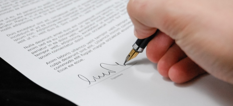 a man signing a paper