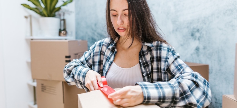 A woman packing boxes