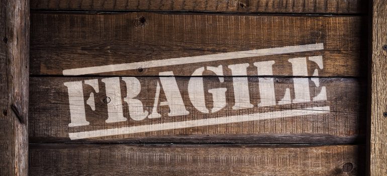 Fragile sign on a wooden crate for moving 