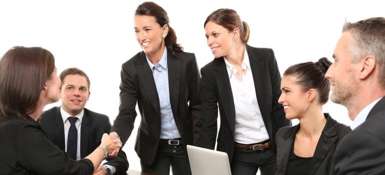 Group of people on business meeting shaking hands