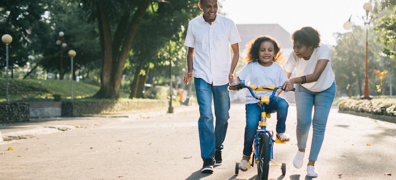 Child learning how to ride a bike