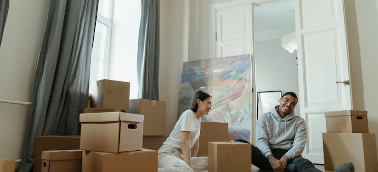 Man and woman packing and smiling