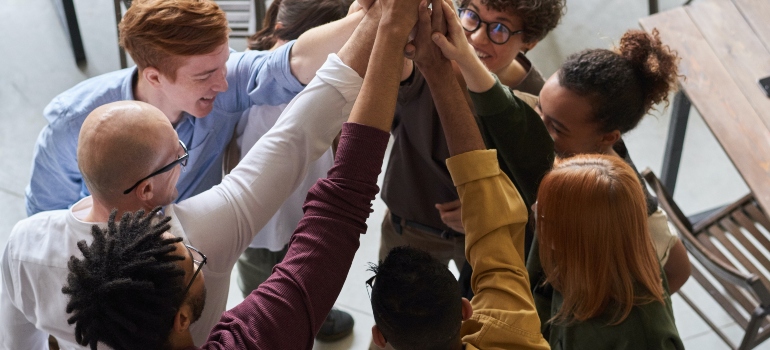 People together pointing in the air