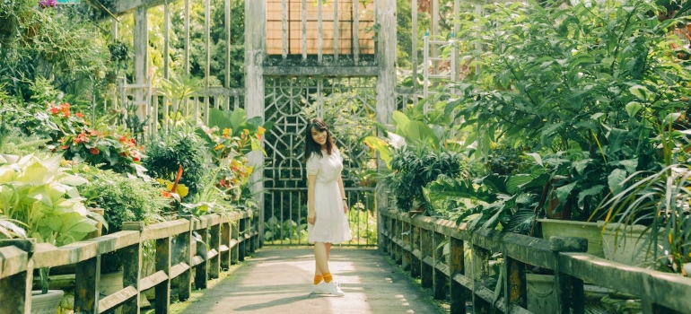 a woman in a botanical garden
