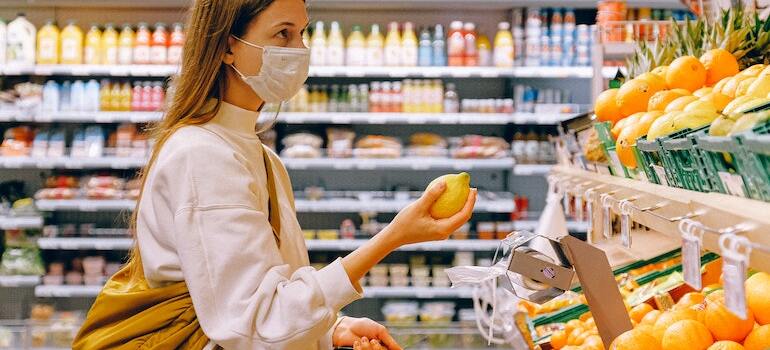 A woman buying groceries inside a store