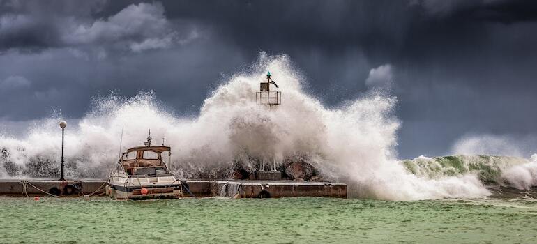 A big wave on a beach during a storm