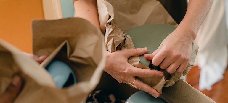 People packing fragile items