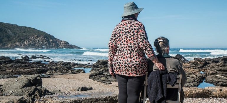 women standing on the coast of Melbourne, which is one of the most affordable cities in Florida for retirees and seniors