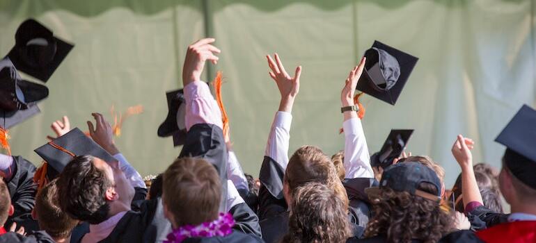 Students celebrating graduation after moving for good education and schools in Fort Myers