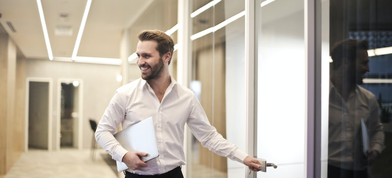 Smiling businessman in the office after moving from Orlando to Jacksonville