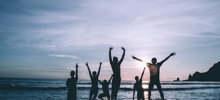 a group of friends enjoying the beach after moving from St. Petersburg to Miami