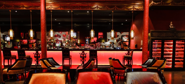 A contemporary restaurant with dimmed red lights in Naples