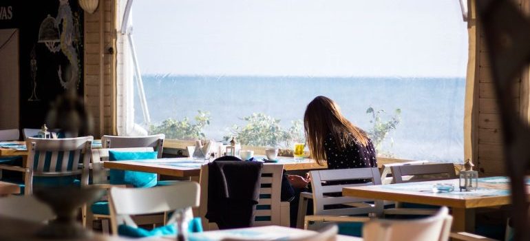 a woman sitting alone in the restaurant 