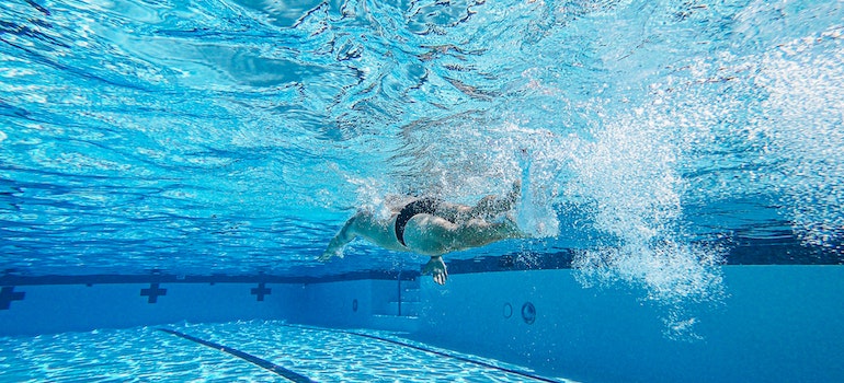 A person swiming in the pool