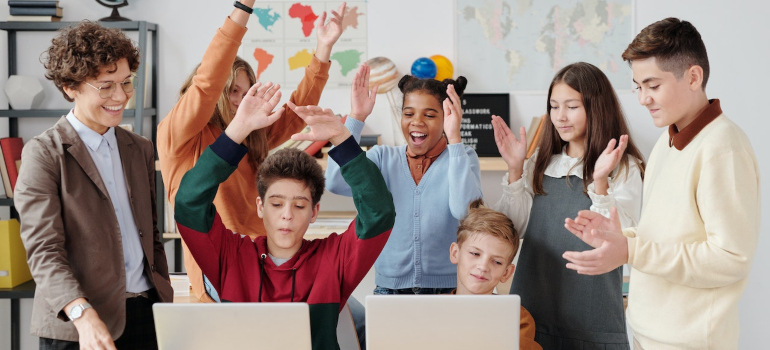 Kids in a class with their teacher