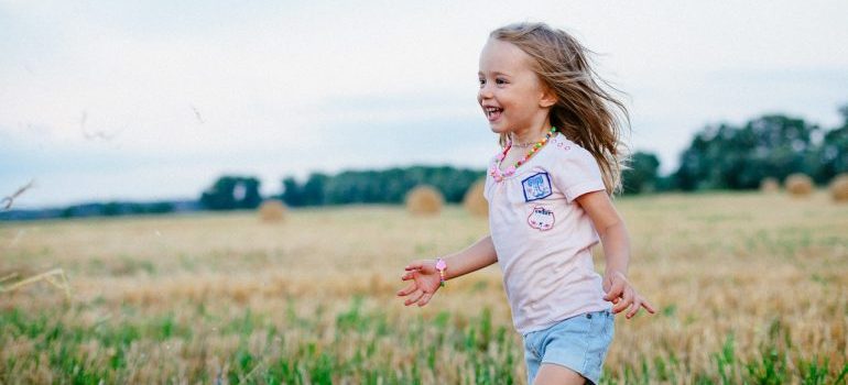 Little girl running in the field
