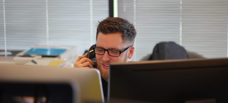 A man talking on the phone to commercial movers Apopka