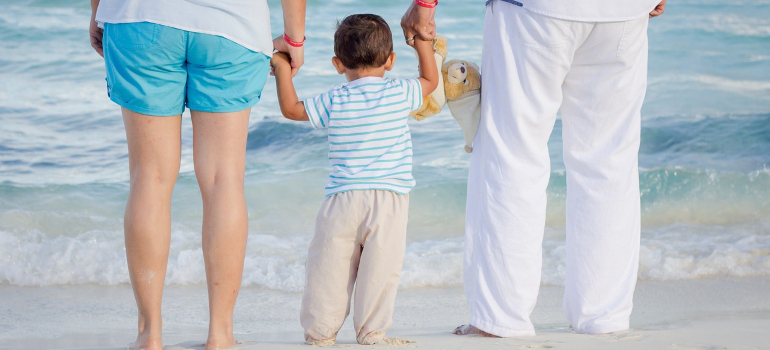 Family with a small child on the beach.