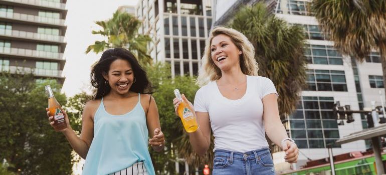 Two women walking and smiling after moving to Tallahassee