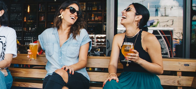 Women drinking beer at the bar