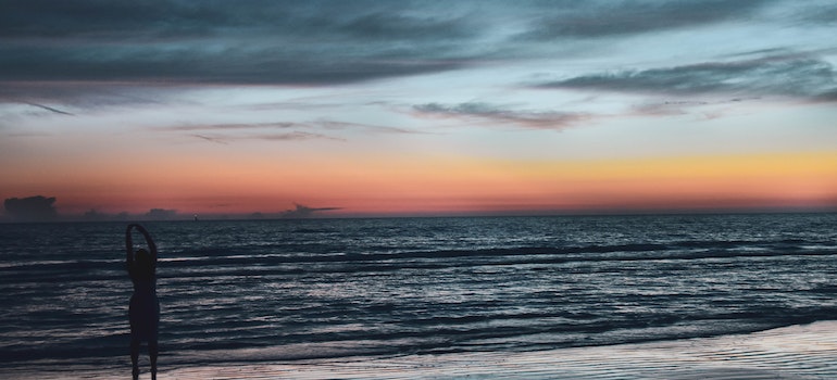 A woman on the beach in one of the cities in Florida people are moving to the most