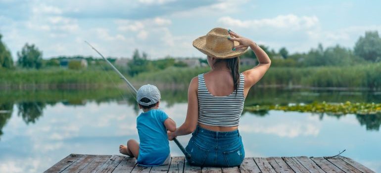 A mom and her son fishing on the lake after moving from Pompano Beach to Lehigh Acres