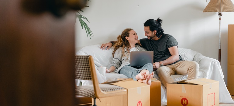 a couple with moving boxes