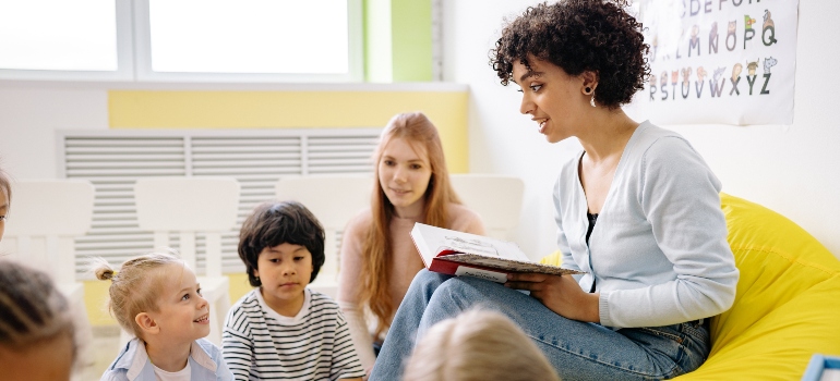 Teacher is reading the book to the kids in one of the best neighborhoods for families in Hialeah 