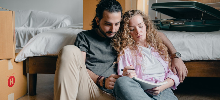 Couple planning a move to the Sunshine State by reading Florida weather alerts