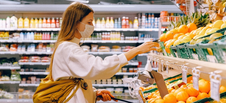 A woman shopping for groceries after moving from Tampa to Clearwater