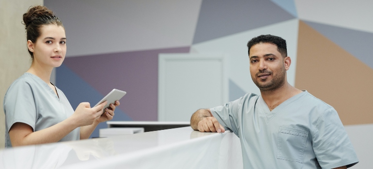 A receptionist and a doctor in a clinic