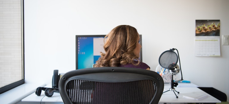 A woman in an office using a laptop