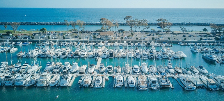 White yachts on clear blue water.