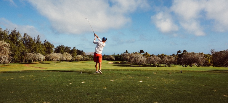 A man playing golf