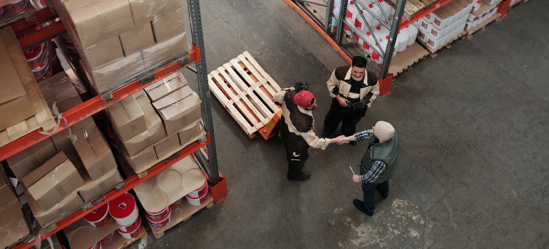 People talking about the future of logistics in Florida in a warehouse