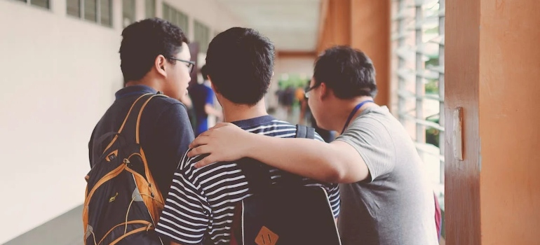 three guys talking to each other