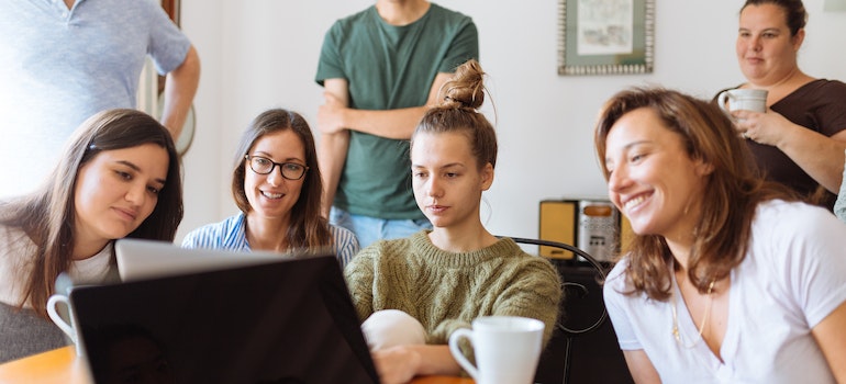 students looking at a laptop