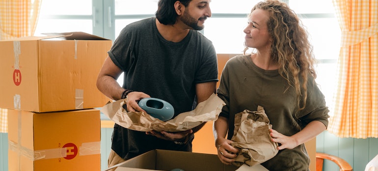 A couple packing boxes