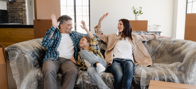 a happy family sitting on a couch