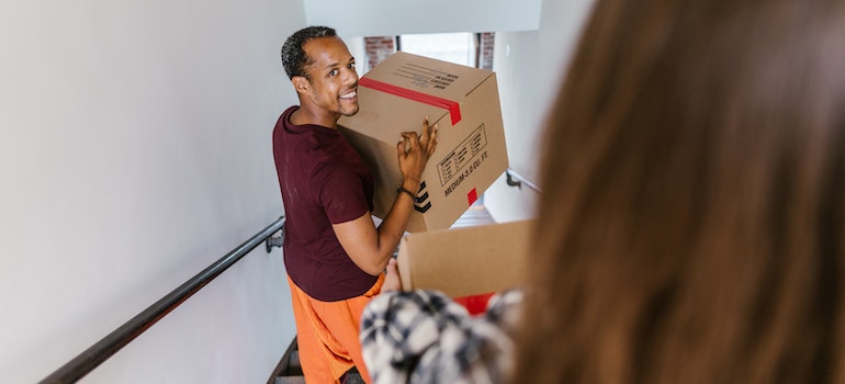 man carrying a box