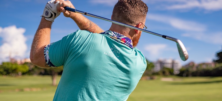 a man playing golf in a field