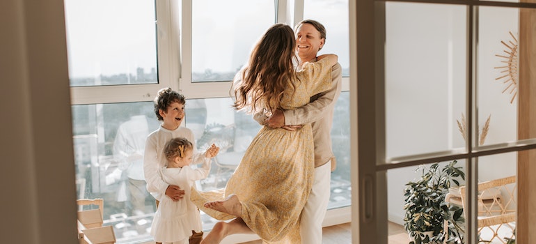 A family celebrating in a sunny loft after moving from Davie to Orlando