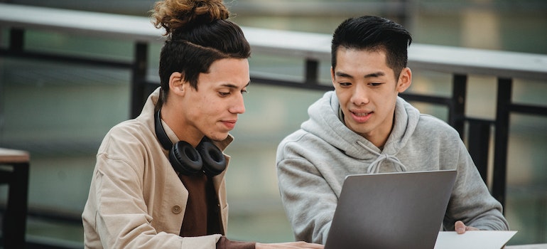 Two students researching the cost of student life in Tampa