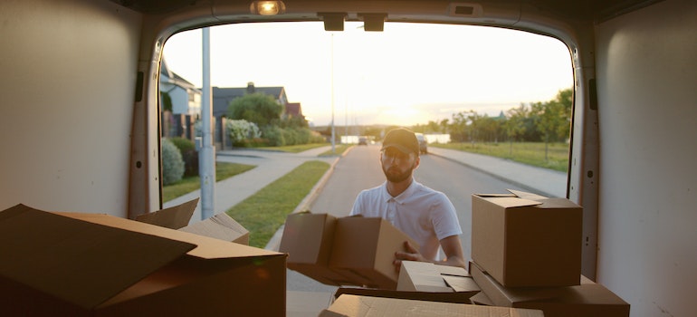 a mover carrying boxes after moving from Riverview to Orlando