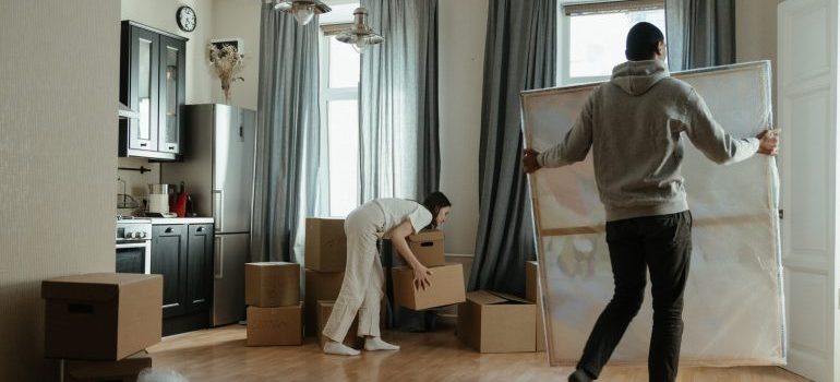 Two people unpacking during their first week after the move