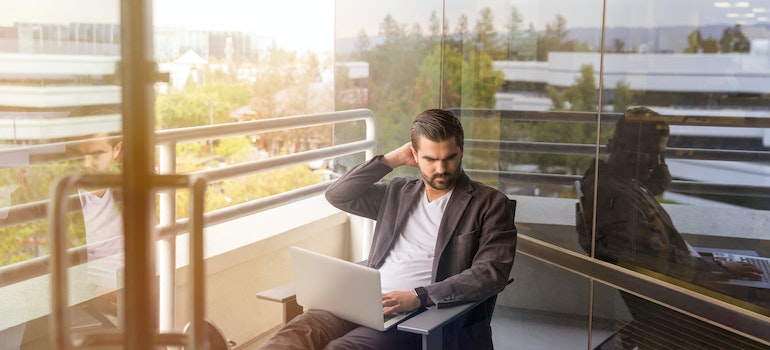 A man looking at a laptop