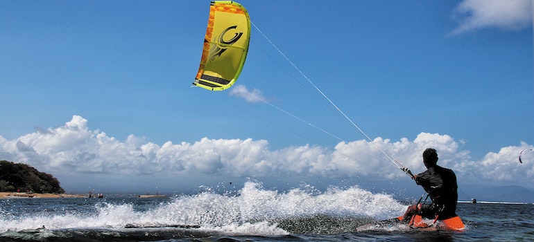 Man kite surfing in one of the best cities in Florida for water activities