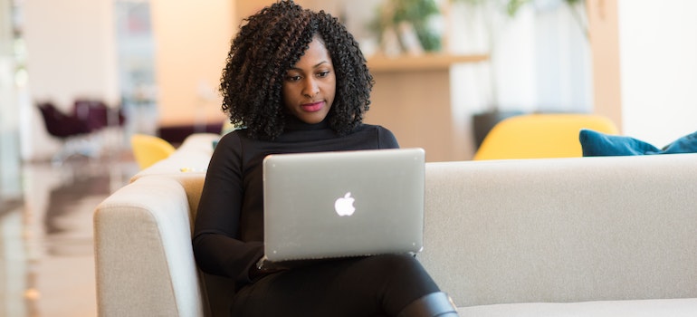 a woman researching how to apply for jobs when moving