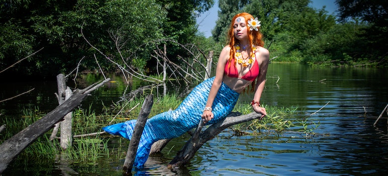 a woman dressed as a mermaid in one of the unusual places to visit in Florida after moving