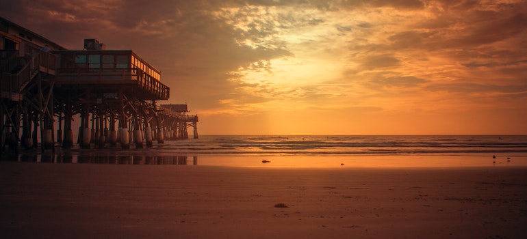 An orange sunset on a beach in Florida